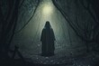 a person in a hooded robe standing in the middle of a dark forest