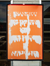 Illegible Thank You Sign At A Gas Station