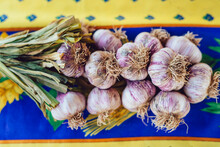 Heads Of Garlic At A Farmers Market