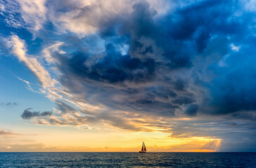 Wall Mural - Sunset Inspirational Storm Sailboat Surreal Nature Ethereal Hope Journey