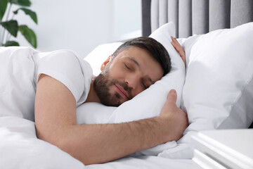 Sticker - Handsome man sleeping in soft bed at home