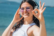 © tetxu - young woman with headphones making ok gesture