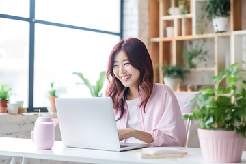 Wall Mural - A Smiling Asian Woman working with her laptop in front of light cream background. generative AI.