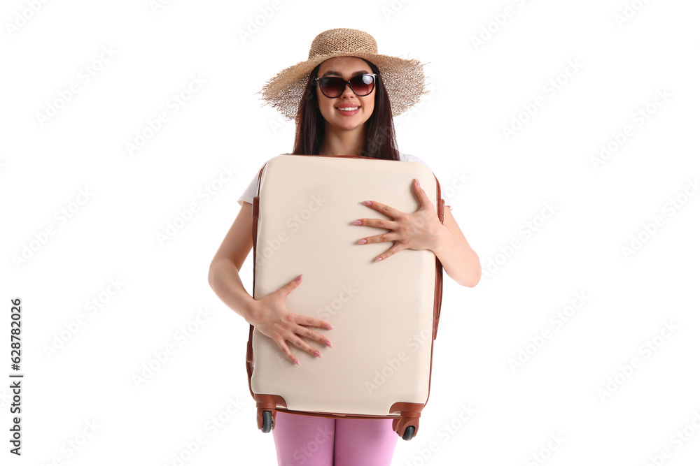 Young woman with beige suitcase on white background