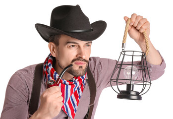 Wall Mural - Handsome cowboy with lantern and smoking pipe on white background, closeup