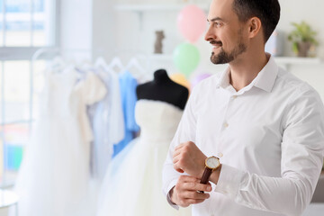 Poster - Male wedding planner working in office