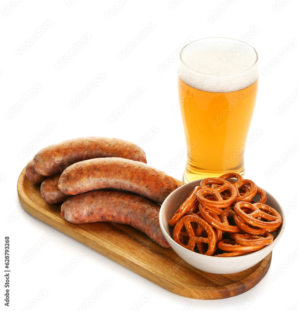 Glass of cold beer and different snacks on white background. Oktoberfest celebration