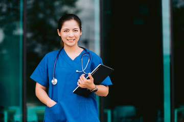 Portrait of a smiling female doctor with stethoscope and clipboard