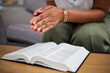 © Daniels C/peopleimages.com - Hands, bible and woman in prayer in home, lounge and reading book of faith, religion and worship study for mindfulness. Person, praying and studying holy book for peace, praise and meditation