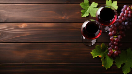 Wall Mural - Grape over a dark wooden table and two glass with red wine.