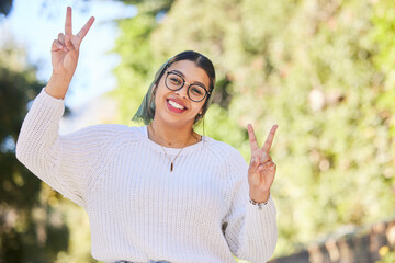 Peace sign, woman portrait and outdoor with a smile of student on summer holiday and vacation. Motivation, happy and emoji v hand gesture feeling silly with freedom and female person from Sudan