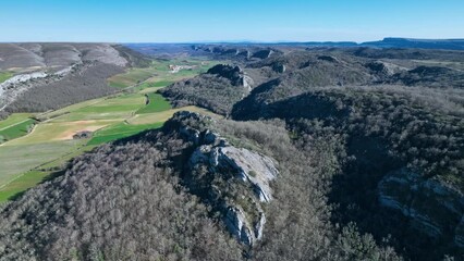 Wall Mural - Aerial view from a drone of the surroundings of the town of Barrio-Lucio. World geological heritage UNESCO. Las Loras Geopark. Valle de Valdelucio Municipality. Burgos. Castile and Leon. Spain. Europe