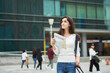 © Dialogue Frame - A woman wearing a backpack and looking at a map at a Korean train station