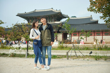 a couple traveling to famous tourist attractions in Korea