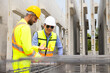 © NVB Stocker - building and construction worker, Hiapanic latin and asian male in safety hard hat helmet working on steel wire mesh for concrete slab reinforcement at Prefabricated concrete walls Manufacturing