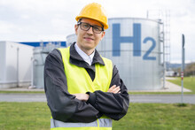 Engineer In Helmet On A Background Of Hydrogen Factory.