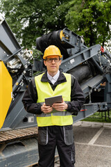 Aufkleber - Engineer with digital tablet next to road construction machine