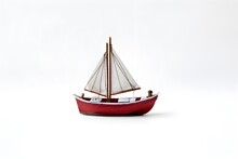 A Toy Boat With A Sail