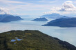Aerial photo of a mountain peak near Juneau, Alaska with Gastineau Channel and Stephens passage in the background.