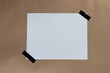 © PixieMe - White paper sheet sticked  with black tape