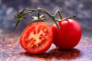 Wall Mural - Ripe red tomato on a flat surface