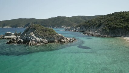 Sticker - Aerial view of Kalamitsi Beach with green mountains coastline and boats by the sea in Greece