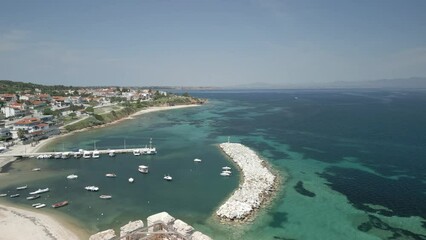 Sticker - Rotating drone footage around Byzantine Tower in Nea Fokea (St. Paul) with turquoise seascape