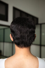 Wall Mural - the black hair of an Asian man from behind