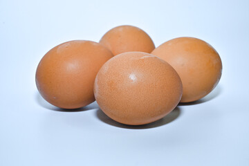 Free-range chicken eggs on a white background close-up