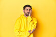 © Asier - Man in yellow hoodie, monochrome studio backdrop who is bored, fatigued and need a relax day.