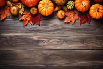 pumpkins and fallen leaves on wooden background. Copy space for text. Halloween, Thanksgiving day or seasonal autumnal