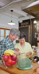 Poster - Asian elderly couple in kitchen