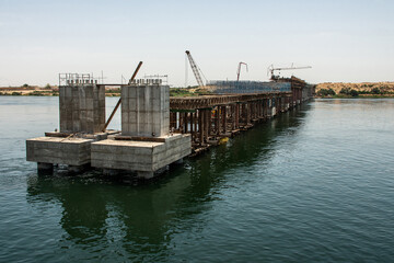 Wall Mural - Build of new Nile river Bridge after Luxor in direction Assuan during boat cruise construction site