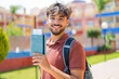 © luismolinero - Young Arabian handsome man at outdoors holding a passport with happy expression