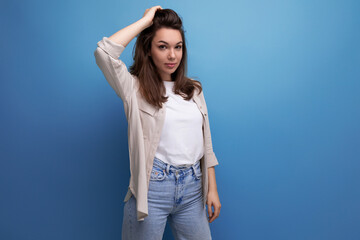 Sticker - cute 25 year old female person in casual look posing on blue background