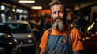 Middle-aged Mechanic with Cool Look Smiling in His Overall at Auto Repair Workshop