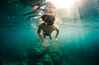 © ADDICTIVE STOCK CORE - Young guy in snorkeling goggles swimming underwater of sea