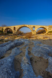 Pont Julien, roman stone arch bridge over Calavon river, Provence, France