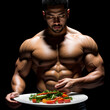 Bodybuilder with vegetables on a plate
