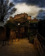 Canvas Print - View of Edinburgh Castle with dark cloudscape above it. Scotland.