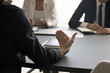 © fizkes - Hand of businessman talking to colleagues, partners, investors on corporate meeting. Business leader speaking to employees, moving arm over table. Mentor training intern. Cropped shot, close up