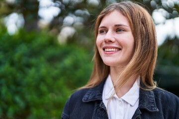 Poster - Young blonde woman smiling confident looking to the side at park