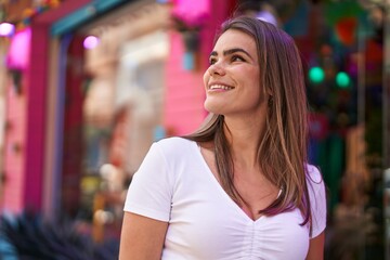 Sticker - Young woman smiling confident looking to the sky at street