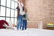 © Krakenimages.com - Adorable boy and girl smiling confident standing on bed at bedroom