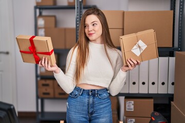 Poster - Young caucasian woman working at small business ecommerce smiling looking to the side and staring away thinking.