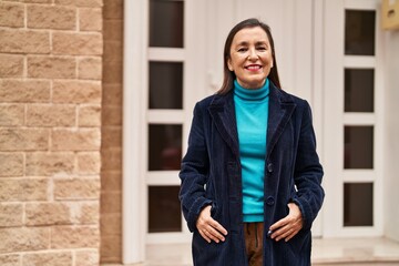 Poster - Middle age woman business executive smiling confident standing at street