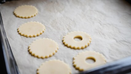 Poster - Shortbread cookies filled with raspberry jam recipe. Placing cookies on baking pan.