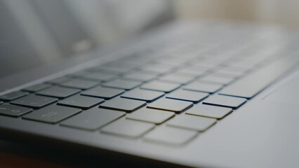 Sticker - Closeup shot of a man hand typing on a keyboard.