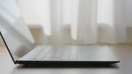 Sticker - Opening a laptop at home.