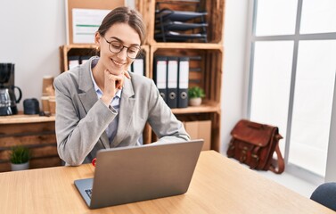 Wall Mural - Young caucasian woman business worker using laptop working at office